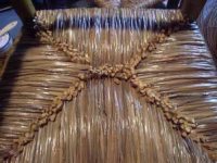 Bottom of hand-twisted natural rush seat.