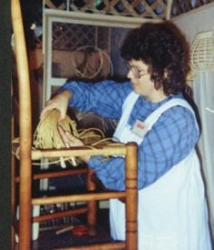 Cathryn Peters weaving a paper fibre rush seat in ladder-back chair.