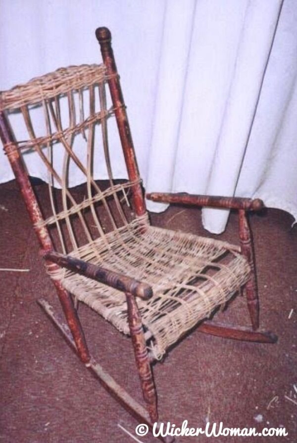 Child's 1920s reed wicker rocker before repair and restoration. 